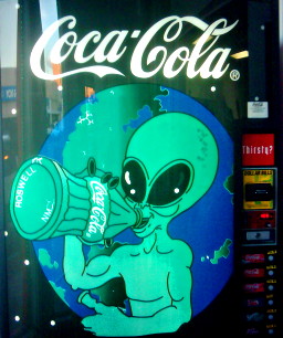 A vending machine in Roswell, New Mexico, showing a space-alien drinking Coca-Cola