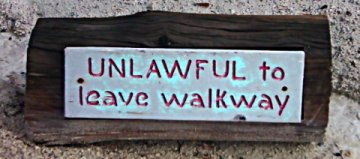 Sign:Unlawful to Leave Walkway